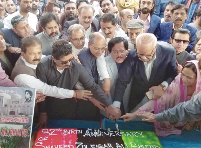 PPP leaders and activists are cutting a cake marking the 92nd birthday anniversary of Zulfiqar Ali Bhutto in the Sindh Secretariat building on Sunday.&mdash;PPI