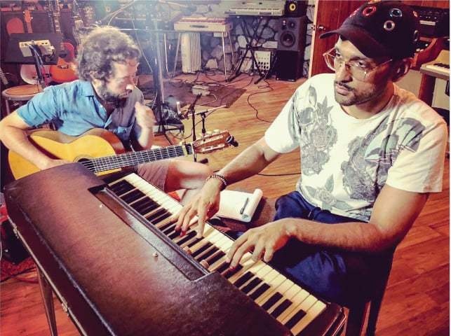 Four-time Grammy award-winning producer Noah Georgeson and Ali Sethi in a studio in Los Angeles | Photo: Luis Ferra