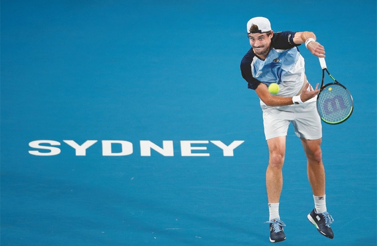 SYDNEY: Argentina’s Guido Pella serves during the ATP Cup quarter-fnal against Karen Khachanov of Russia at the Ken Rosewall Arena on Thursday.—Reuters