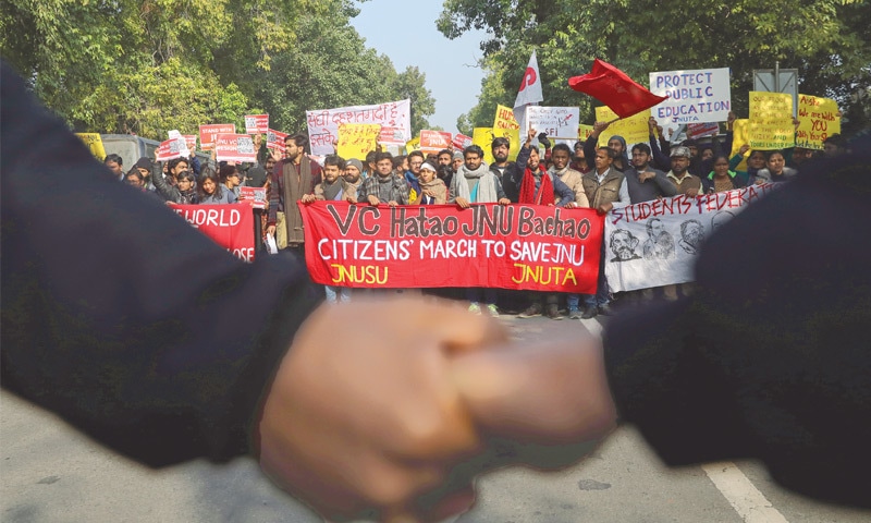 NEW DELHI: Demonstrators carry placards and shout slogans during a march against attacks on the students of Jawaharlal Nehru University.&mdash;Reuters
