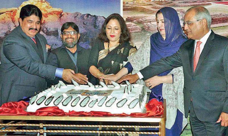 Nepali Ambassador Sewa Lamsal and other guests cut a cake to mark the launching of &lsquo;Visit Nepal 2020&rsquo; in Islamabad. &mdash; APP