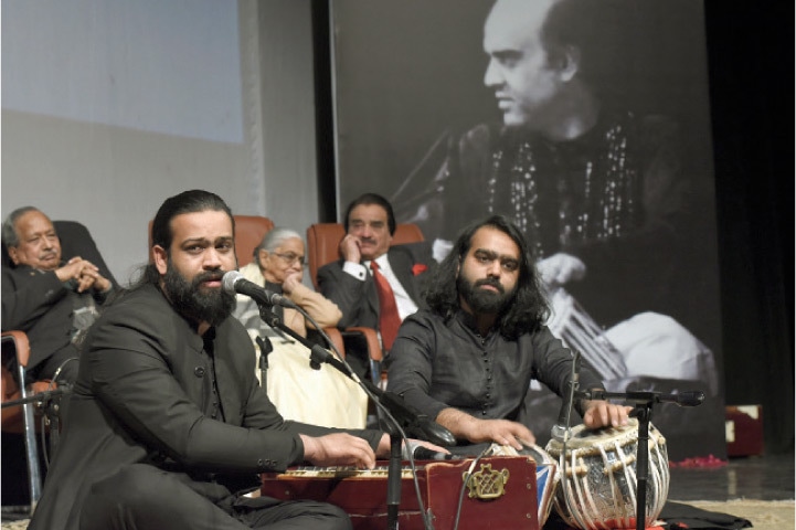 Yawar Bakhshi and Sherry Bakhshi perform during the Rasm-e-Chehlum event held in memory of tabla player Mohammad Ajmal Khan at the PNCA on Saturday. — White Star