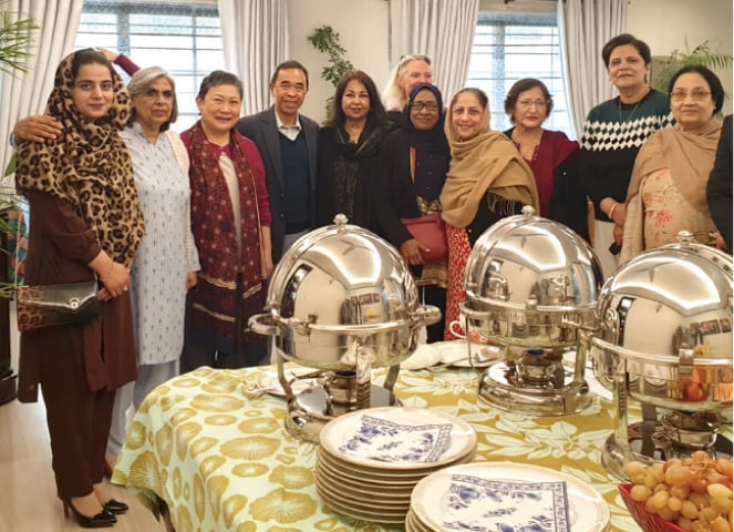 Spouse of the high commissioner of Brunei poses with members of the Asian Study Group in Islamabad.