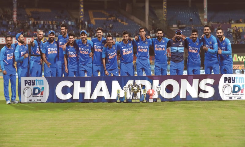 BENGALURU: Members of Indian team pose with the trophy after the third One-day International against Australia on Sunday.—AP