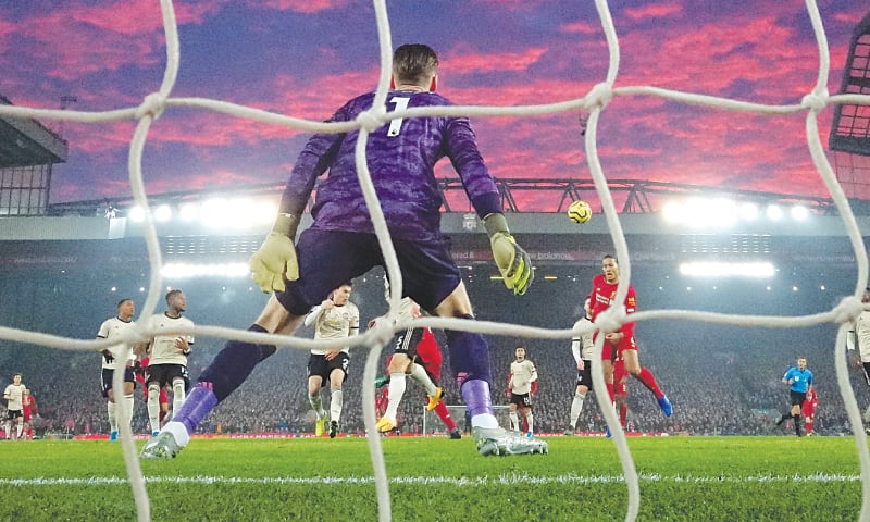 LIVERPOOL: Virgil van Dijk (R) heads to score Liverpool’s first goal during the Premier League match against Manchester United at Anfield.—AP LIVERPOOL: Virgil van Dijk (R) heads to score Liverpool’s first goal during the Premier League match against Manchester United at Anfield.—AP