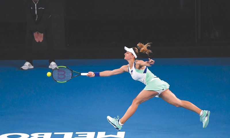 UKRAINE&rsquo;S Lesya Tsurenko stretches for a return against Ashleigh Barty of Australia during their first-round match at the Australian Open on Monday.&mdash;AFP