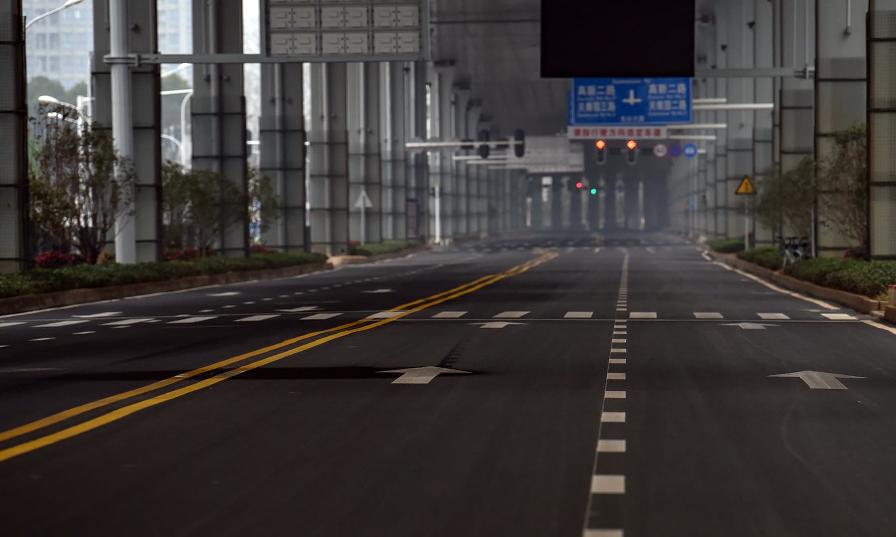 An empty road is seen on the first day of the Lunar New Year in Wuhan in China's central Hubei province on January 25, 2020, during a deadly virus outbreak which began in the city. — AFP