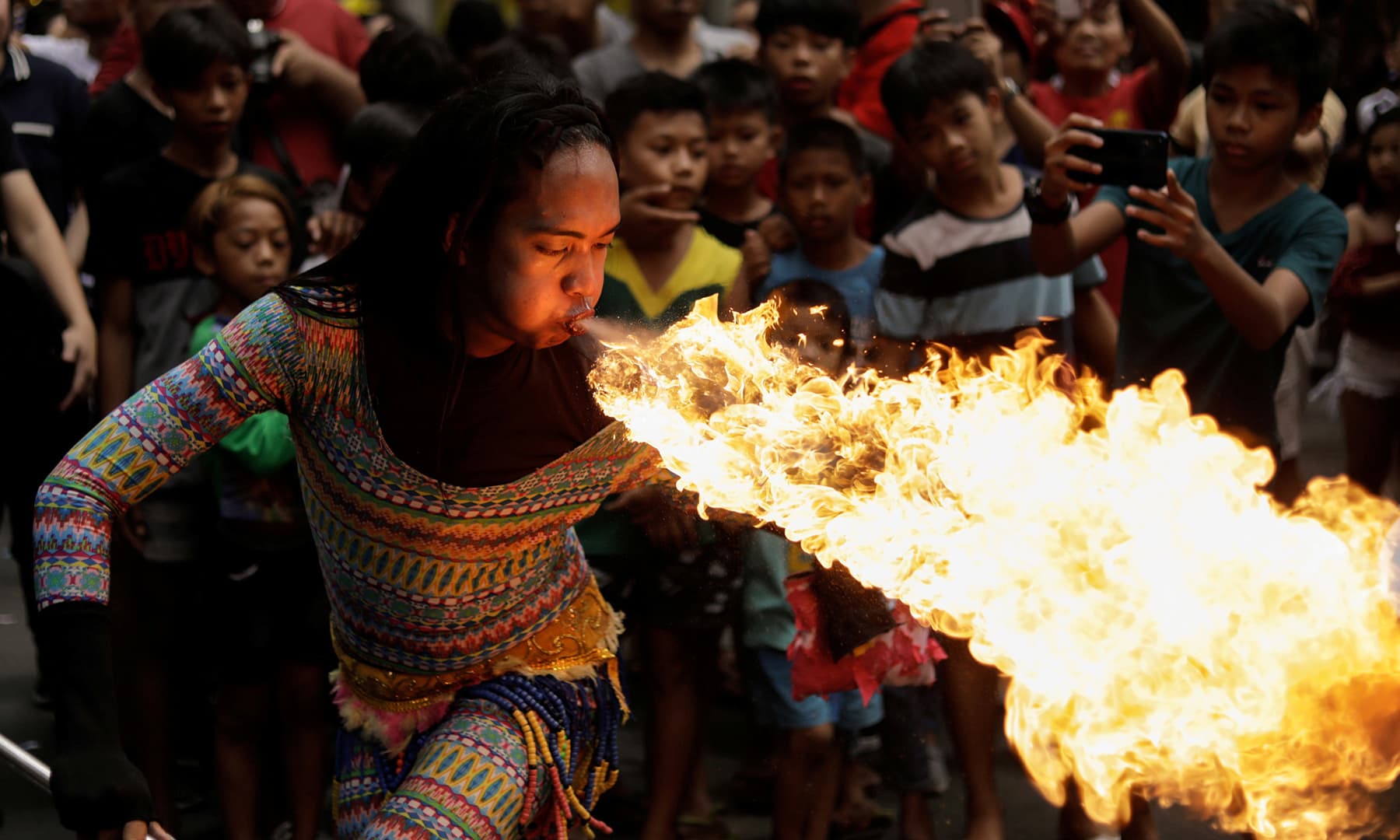 A performer blows fire during Chinese Lunar New Year celebrations in Chinatown, Binondo, Manila, Philippines on January 25, 2020. — Reuters