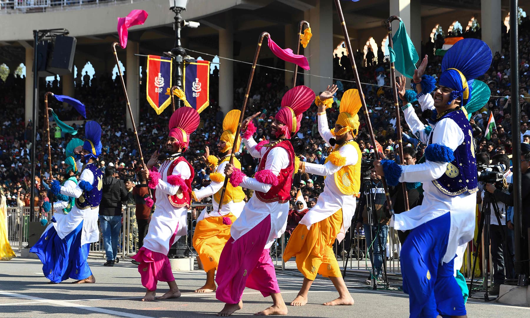 Artists perform during a ceremony to celebrate India's Republic Day at the India-Pakistan Wagah border post. — AFP