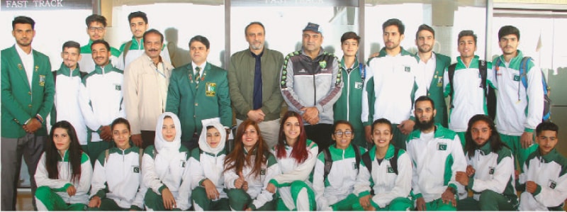 PAKISTAN&rsquo;S taekwondo squad seen at the Quaid-e-Azam International Airport on Wednesday with South Asian Taekwondo Fedration president Umar Saeed, SOA vice-chairman Asif Azeem and Sindh Taekwondo Association secretary Kamran Qureshi prior to their departure for Dubai to compete in the 8th Al-Fujairah Open Championship.