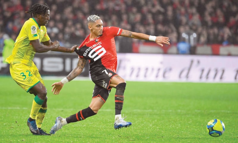 RENNES: Rennes&rsquo; Raphinha (R) vies with Nantes&rsquo; Abdoul Kader Bamba during their Ligue 1 match at the Roazhon Park.&mdash;AFP