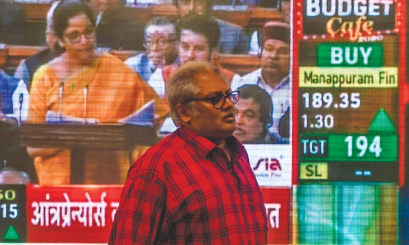 A man walks past a screen displaying a television channel live broadcast of India’s Finance Minister Nirmala Sitharaman presenting the 2020 union budget, at the Bombay Stock Market in Mumbai on Saturday. India relaxed its fiscal deficit target, raising spending and slashing taxes as it seeks to attract foreign investment and increase consumption in the wake of a prolonged economic slowdown. In a sprawling three-hour speech peppered with references to ancient Indian history and poetry, Sitharaman said the fiscal deficit target for the current financial year was now 3.8 per cent of GDP, up from A man walks past a screen displaying a television channel live broadcast of India’s Finance Minister Nirmala Sitharaman presenting the 2020 union budget, at the Bombay Stock Market in Mumbai on Saturday. India relaxed its fiscal deficit target, raising spending and slashing taxes as it seeks to attract foreign investment and increase consumption in the wake of a prolonged economic slowdown. In a sprawling three-hour speech peppered with references to ancient Indian history and poetry, Sitharaman said the fiscal deficit target for the current financial year was now 3.8 per cent of GDP, up from