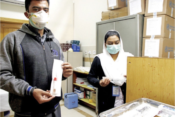Hospital staff show medicines available at the newly-established ward dedicated to treating coronavirus at Pims.