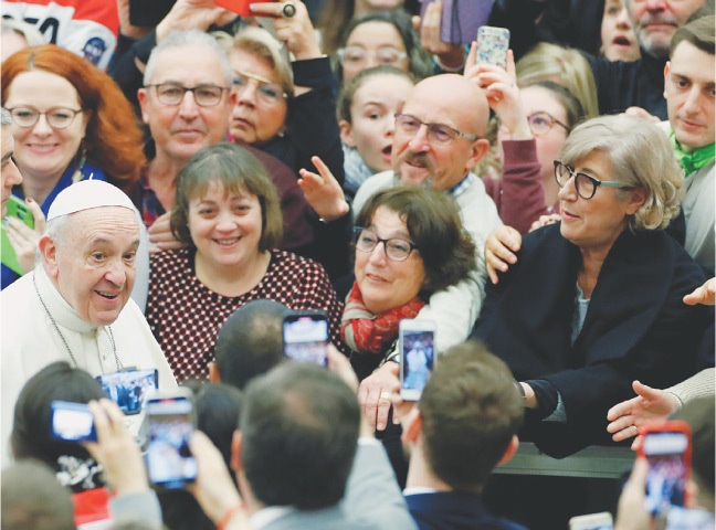 Pope Francis greets people during the weekly general audience at the Vatican on Wednesday.—Reuters