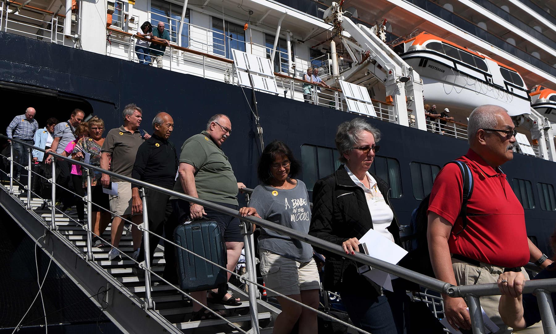 Passengers disembark from the Westerdam cruise ship in Sihanoukville on Feb 15. &mdash; AFP