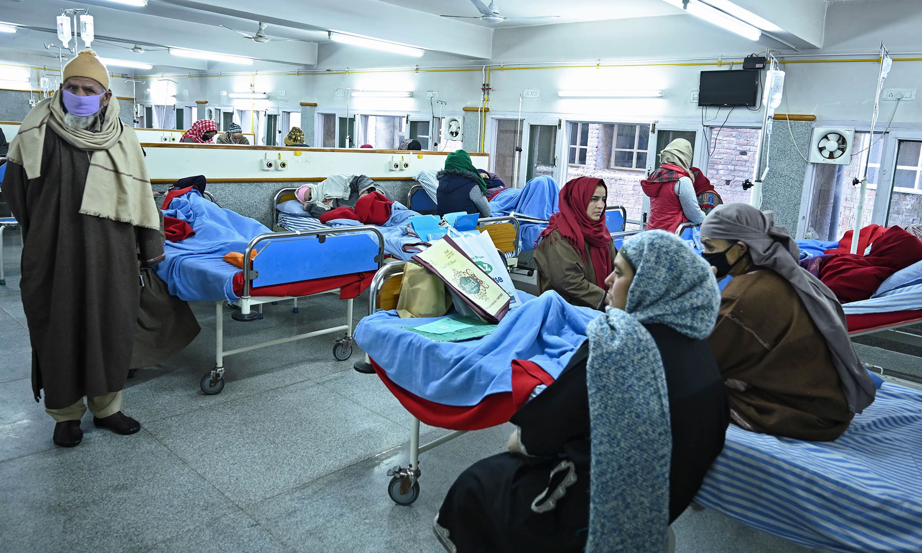 Cancer patients rest inside a hospital ward in Srinagar. — AFP