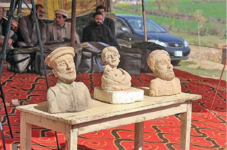 Sculptures displayed at a stall at a spring fair in Swabi on Wednesday. — Dawn