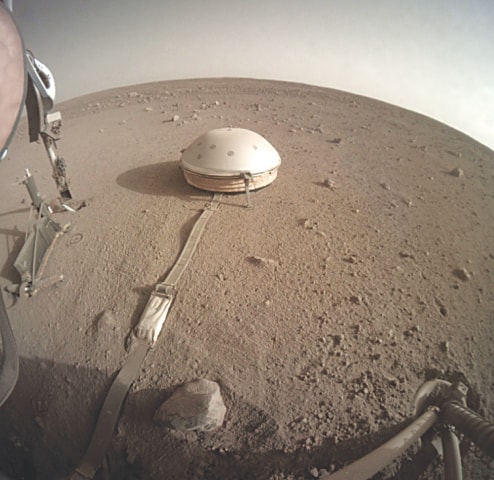 The InSight lander’s dome-covered seismometer on Mars.—AP