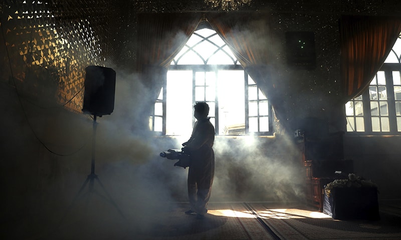 A firefighter disinfects the shrine of Saint Saleh to help prevent the spread of the new coronavirus in northern Tehran, Iran on March, 6, 2020. &mdash; AP