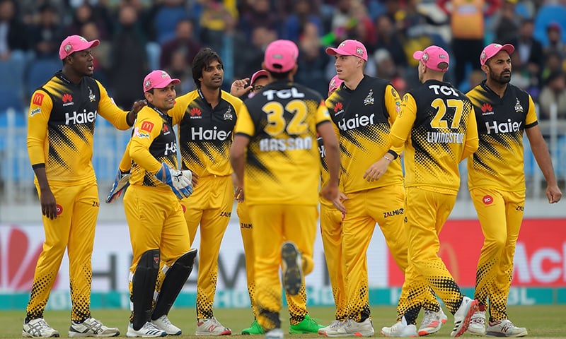 Peshawar Zalmi's Rahat Ali (pictured third left) celebrates after dismissing Islamabad United's Luke Ronchi during their PSL 2020 match on Sunday. — AFP