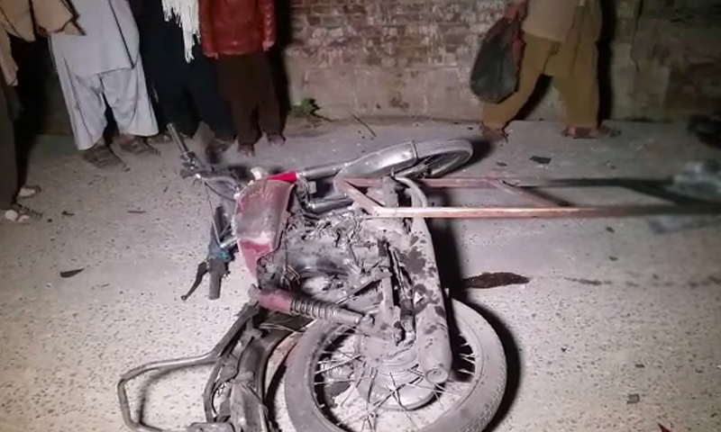 A mangled motorcycle at the scene of the blast. — DawnNewsTV