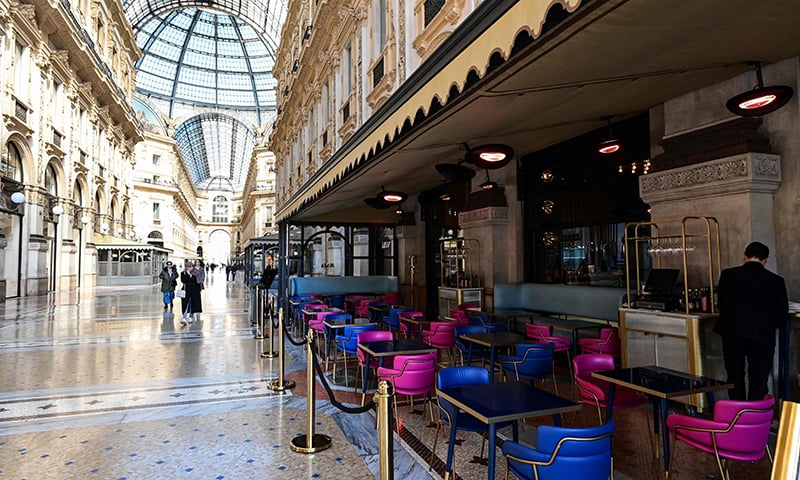 People walk in the deserted Galleria Vittorio Emanuele II in central Milan after millions of people were placed under forced quarantine in northern Italy as the government approved drastic measures in an attempt to halt the spread of the COVID-19 outbreak. &mdash; AFP