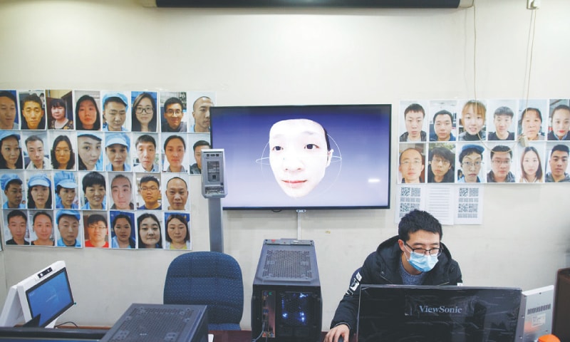 Beijing: A software engineer works on a facial recognition programme that identifies people when they wear a face mask.—Reuters Beijing: A software engineer works on a facial recognition programme that identifies people when they wear a face mask.—Reuters