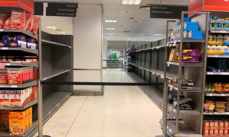 Empty shelves are seen in a now closed aisle at a supermarket in Canary Wharf, in London, as the number of coronavirus cases grow around the world. &mdash; Reuters