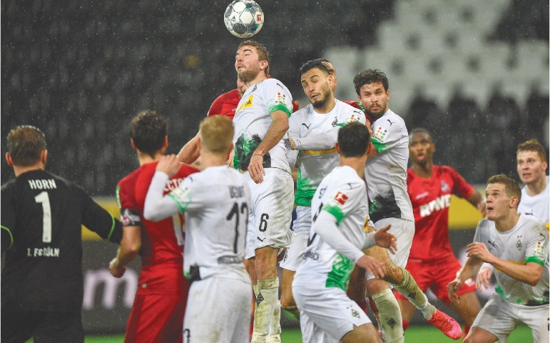 MOENCHENGLADBACH&rsquo;S Christoph Kramer jumps for the ball during the Bundesliga match against Cologne.&mdash;AP