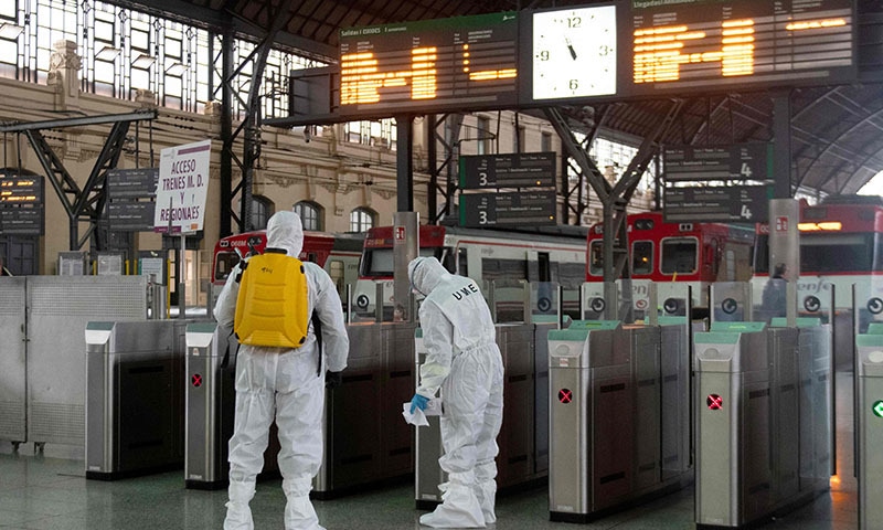 Military Emergencies Unit (UME) members carry out a general disinfection at the North train station in Valencia on March 16, 2020. -Spain has registered nearly 1,000 new COVID-19 infections over the past 24 hours, raising the total number of cases to 8,744, the health ministry said today. &mdash;AFP