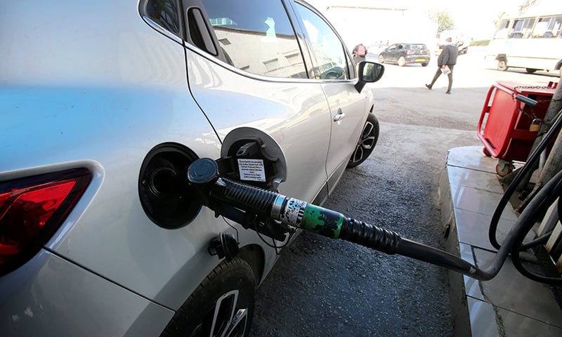 A car is being filled with fuel at a gas station in Algiers, Algeria, March 10. — Reuters