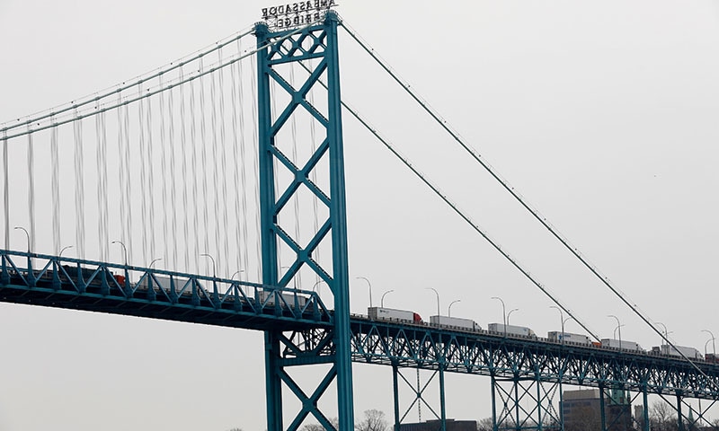 Vehicles cross the Ambassador Bridge in to Detroit, Michigan from Windsor, Canada, on March 18, 2020. US and Canada have mutually agreed to temporarily restrict "non essential traffic" across Canada-US border due to the coronavirus pandemic. — AFP