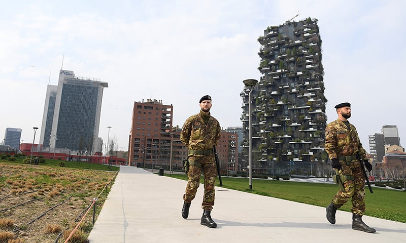 Italian army soldiers patrol streets after being deployed to the region of Lombardy to enforce the lockdown against the spread of coronavirus disease in Milan on March 20. — Reuters Italian army soldiers patrol streets after being deployed to the region of Lombardy to enforce the lockdown against the spread of coronavirus disease in Milan on March 20. — Reuters