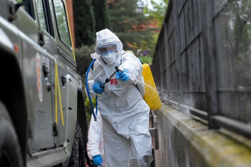 A member of the Military Emergencies Unit (UME) carries out a general disinfection at the Betesda Foundation for the mentally disabled in Madrid on March 27, 2020. The death toll in Spain soared over 4,800 after 769 people died in 24 hours, in what was a record one-day figure for fatalities in the country. &mdash; AFP