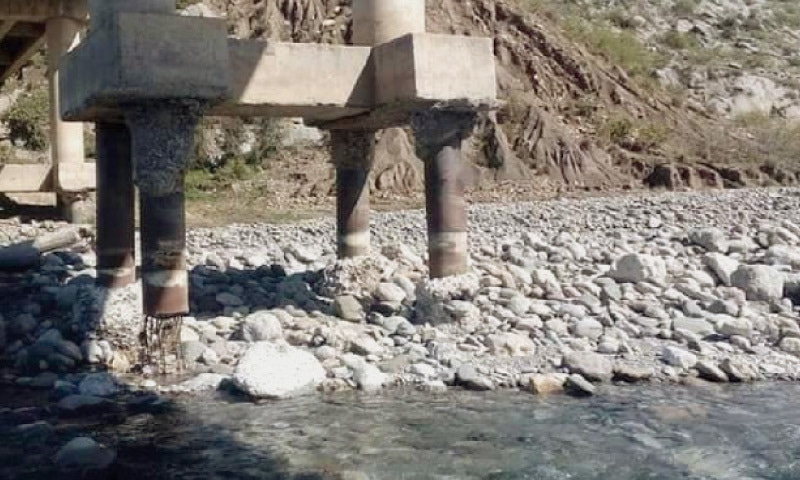 Dilapidated condition of Tarnava bridge on River Harro in Khanpur poses a danger to commuters. &mdash; Dawn