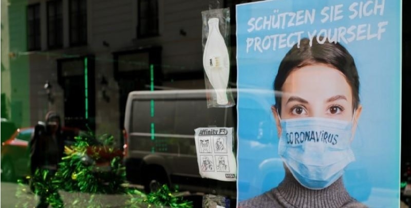 Face masks are on display in a closed shop during the spread of Covid-19 in Vienna, Austria on March 19. &mdash; Reuters
