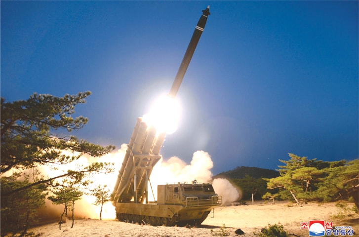 PYONGYANG: A test-fire of super-large multiple rocket launchers at an undisclosed location in North Korea.—AFP
