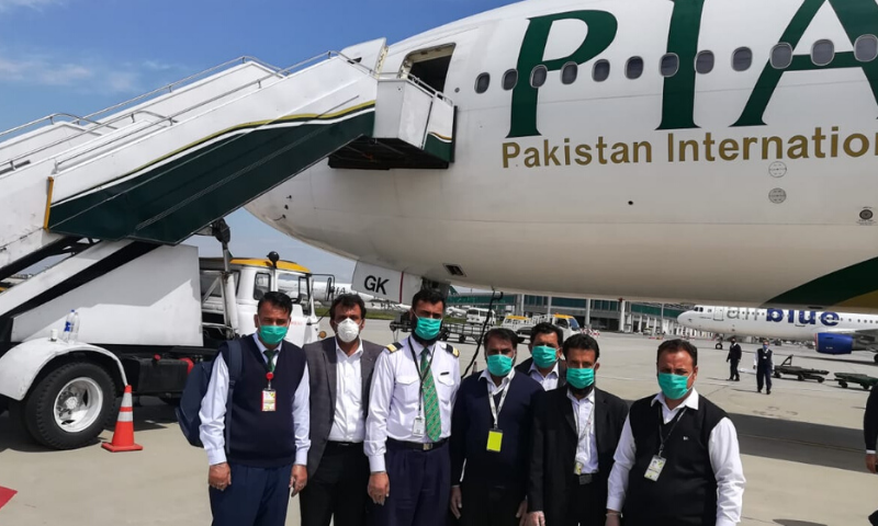 Seven members of the flight crew on the special PIA flight to Beijing.