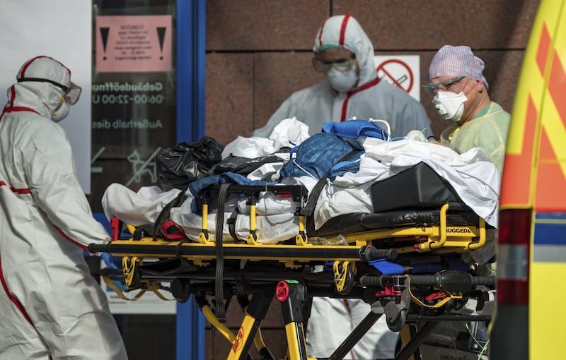 In this March 25, 2020, file photo, a patient with Covid-19, flown in an Italian Air Force plane from Italy is admitted to the Helios Klinikum in Leipzig, Germany. In the rare position of having beds to spare, German hospitals have taken in dozens of patients from Italy and France. — AP