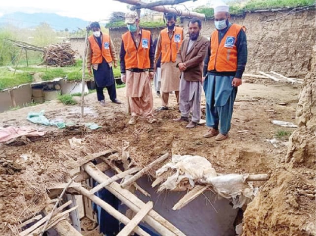 Rescue workers at the site of roof collapse incident in Khar, Bajaur, on Wednesday. &mdash; Dawn