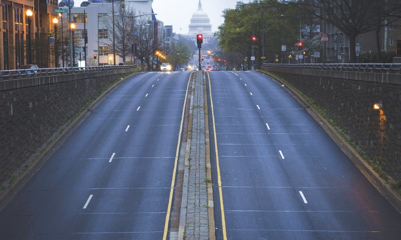 WASHINGTON: A mostly empty North Capitol Street is seen at dusk on Tuesday evening.&mdash;AFP