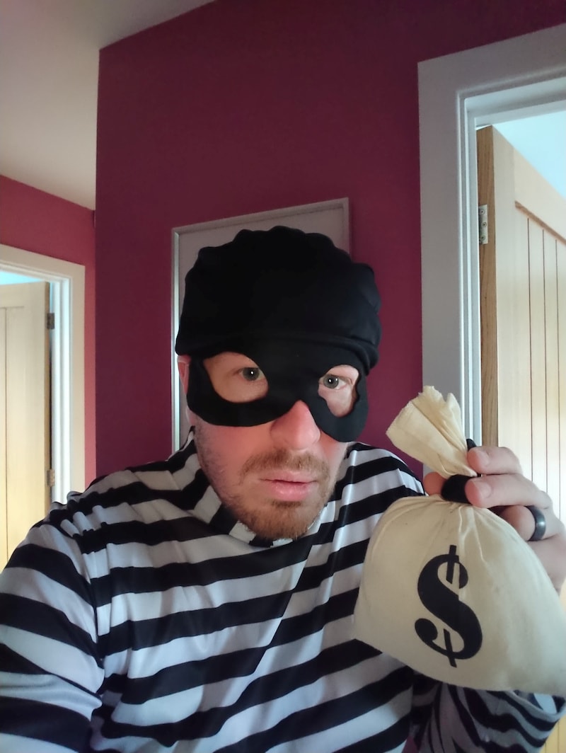 Glen Walton, a postman, wears a robber outfit at work and raises money for charity, as the spread of coronavirus disease continues, in Mansfield Woodhouse, Britain, on April 3, 2020. — Reuters