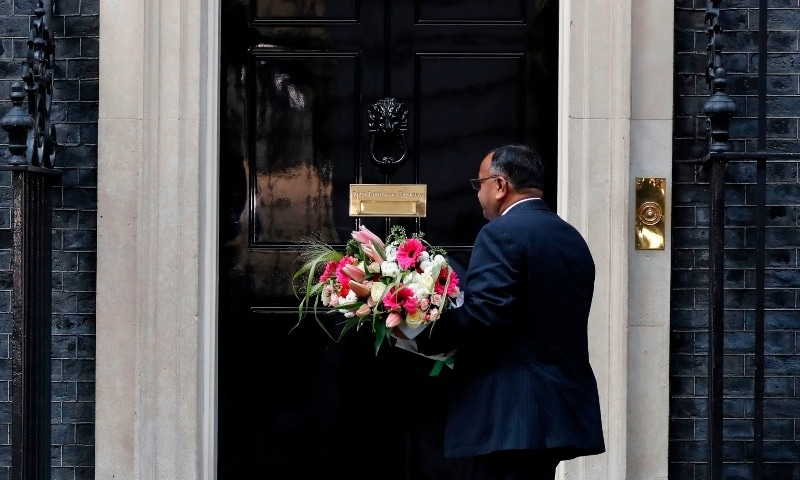 Flowers from the Pakistan embassy are delivered to 10 Downing Street in central London on April 7 as Britain's Prime Minister Boris Johnson spent the night in intensive care at St Thomas' Hospital with symptoms of the novel coronavirus. Johnson spent the night in intensive care after being admitted with a deteriorating case of coronavirus, prompting serious concerns about his health and the government's response to a still-escalating outbreak. &mdash; AFP