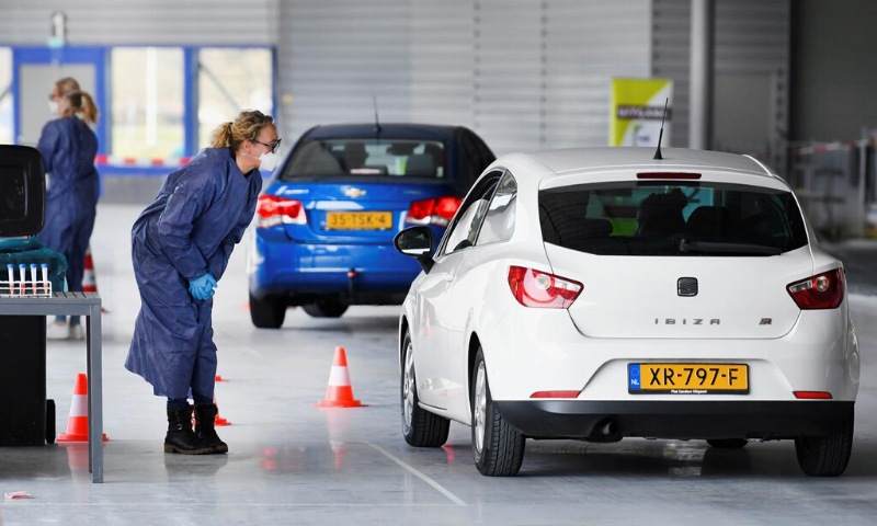 A member of medical staff takes coronavirus test samples at a drive-thru coronavirus testing centre, on a converted ice rink, in Alkmaar, Netherlands. — Reuters