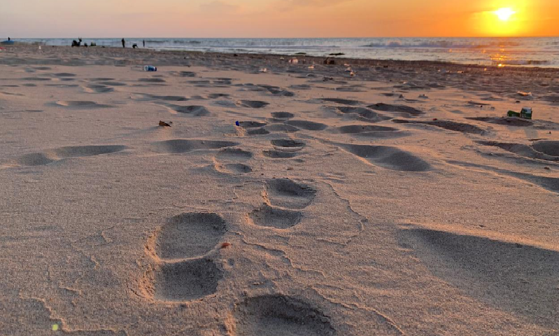 Footprints are seen on a beach during sunset amid concerns about the spread of Covid-19, in the northern Gaza Strip, April 8. &mdash;Reuters