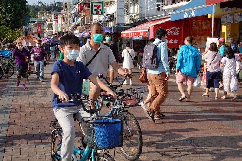 People wearing face masks are seen at Cheung Chau island during Easter weekend, amid the novel coronavirus disease outbreak, in Hong Kong, China on April 12, 2020. &mdash; Reuters