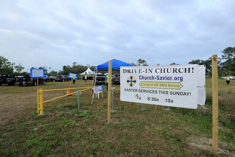 People attend a drive-in Easter service at the Church of Our Savior service amid the coronavirus outbreak on April 12, 2020 in Jacksonville Beach, Florida. Gov. Ron DeSantis has not closed places of worship, but is still urging residents to adhere to social distance guidelines. &mdash; AFP