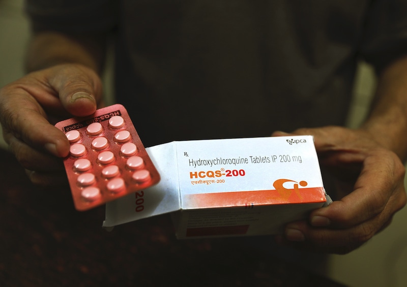 FILE - In this Thursday, April 9, 2020 file photo, a chemist displays hydroxychloroquine tablets in New Delhi, India. Scientists in Brazil have stopped part of a study of the malaria drug touted as a possible coronavirus treatment after heart rhythm problems developed in one-quarter of people given the higher of two doses being tested. Chloroquine and a similar drug, hydroxychloroquine, have been pushed by President Donald Trump after some early tests suggested the drugs might curb coronavirus entering cells.  (AP Photo/Manish Swarup, File) &mdash; Copyright 2020 The Associated Press. All rights res