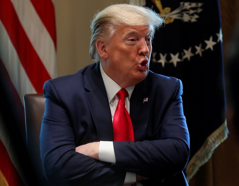 US President Donald Trump speaks during a meeting with recovered Covid-19 patients and family members in the Cabinet Room at the White House in Washington, US, on April 14, 2020. — Reuters