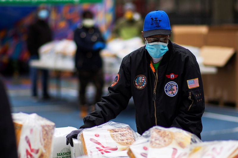 A person organizes food donated by City Harvest Mobile Market Food Distribution Center, during the outbreak of the coronavirus disease (COVID-19) in the Brooklyn borough of New York, U.S., April 15, 2020. REUTERS/Eduardo Munoz